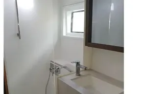 Modern bathroom in 2020 Lagoon 46 yacht with shower and sink.