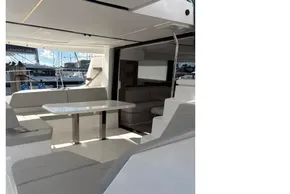 Modern interior of 2025 Leopard 46 yacht with sleek seating and table.