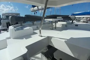 2022 Leopard 45 yacht deck with seating, under a clear blue sky.