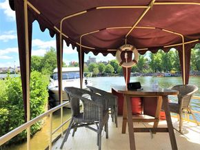Interior of a classic 1927 Dutch barge on a river.