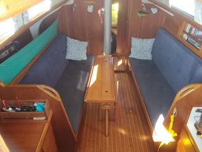 large Saloon with folding table . All berths have lea cloths.