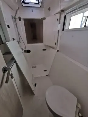 2017 Leopard 43 Powercat bathroom with shower, toilet, and storage cabinets.