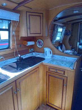 Light Galley with ample storage and houdini hatch over