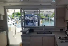 Interior of a 2017 Leopard 48 yacht kitchen with marina view.
