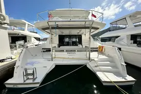 2025 Robertson and Caine Leopard 46 Powercat docked, rear view with clear skies.