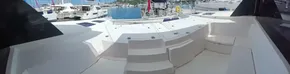 Spacious deck of 2019 Leopard 45 yacht in marina setting.
