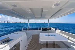 Leopard 40 Powercat 2025 yacht interior with ocean view, featuring modern design and spacious layout.