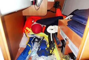 Storage compartment of 2017 Jeanneau Sun Odyssey 389 with life jackets and sailing gear.