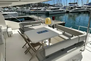 Leopard 53 Powercat 2022 yacht with outdoor seating at marina.