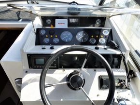 1995 Aquafibre Bounty Boats 10/70 dashboard with steering wheel and instrument panel.