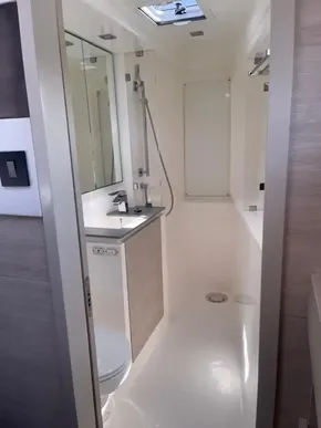Modern bathroom in 2020 Leopard 50 yacht with sleek fixtures and skylight.