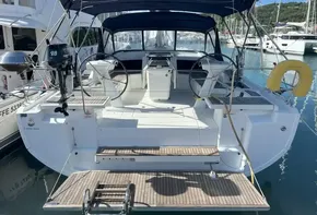 2020 Beneteau Oceanis 46.1 yacht docked at marina, featuring dual steering wheels.