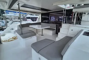 Spacious 2020 Leopard 45 yacht interior with modern seating and dining area.