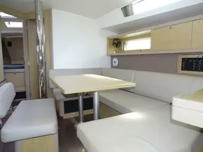 2017 Beneteau Oceanis 45 interior with modern dining area and light wood finishes.