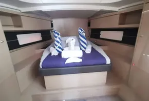 Luxurious cabin interior of 2020 Beneteau Oceanis 46.1 yacht with elegant bedding.
