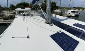 2020 Leopard 50 yacht with solar panels docked at marina.