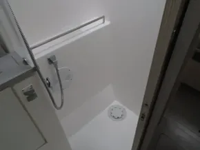 2017 Leopard 45 yacht shower area with handheld showerhead and drain.
