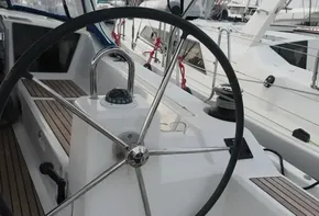 Steering wheel of 2019 Beneteau Oceanis 41.1 sailboat with teak decking.
