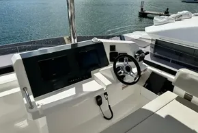 2025 Robertson and Caine Leopard 46 Powercat helm with modern controls and ocean view.