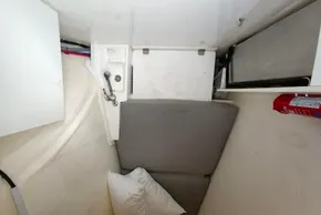 Compact interior of 2019 Leopard 50 yacht with seating, sink, and fire extinguisher.