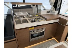 Jeanneau NC 37 twin diesel cruiser - galley with stove, oven and sink