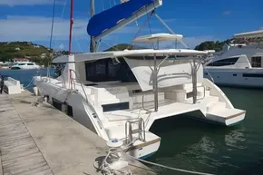 2018 Leopard 45 catamaran docked at marina, featuring spacious deck and modern design.