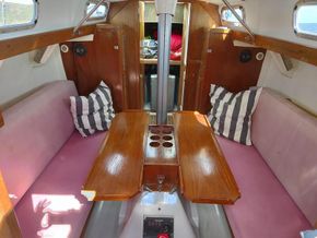 Engine amidships below table, 2 x settee berths with seatback becoming pilot berths