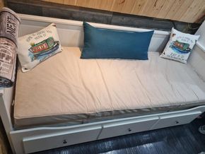 Bed pulls out to king sized with storage
