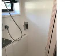 Compact shower area in a 2020 Leopard 40 yacht, featuring modern fixtures.