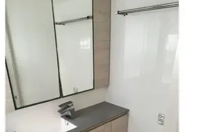 Modern bathroom in 2021 Leopard 50 yacht with sleek fixtures and ample storage.