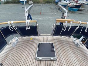 Teak after deck,showing davits, aft boarding, and yellow emergency steering access point