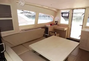 Interior of 2017 Leopard 43 Powercat with dining area and large windows.