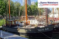 Kotter varend woonschip