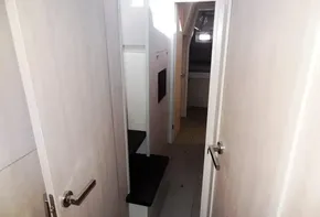 Interior hallway of 2015 Leopard 51 Powercat yacht with light wood finish.
