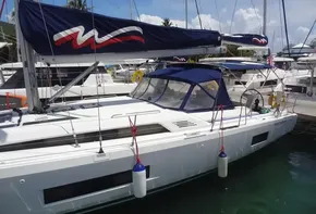 2020 Beneteau Oceanis 46.1 sailboat docked in a marina.