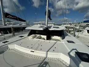 Leopard 50 catamaran, 2020 model, docked at marina under blue sky.