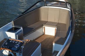 2026 Enkhuizensloep 744 Tender boat interior with cushioned seating and wooden flooring.