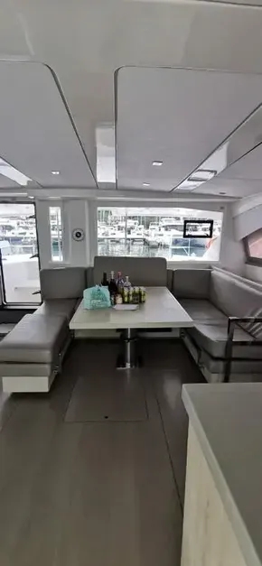 Interior of 2019 Leopard 51 Powercat with dining area and marina view.