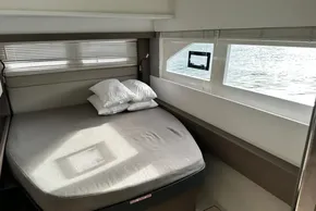 Interior cabin of 2022 Leopard 53 Powercat with bed and window view.