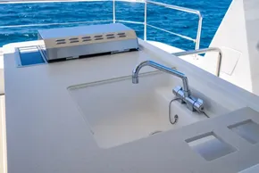 Outdoor sink and grill on 2025 Leopard 40 Powercat yacht, with ocean view.