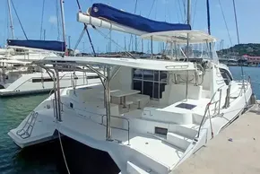 2017 Leopard 48 catamaran docked at marina, featuring spacious deck and seating area.