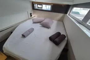 Luxurious cabin interior of a 2020 Leopard 45 yacht with neatly arranged bedding.