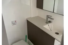 Compact bathroom in 2022 Leopard 45 yacht with modern sink and toilet.