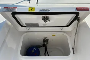Open gas bottle storage locker on 2024 Leopard 40 Powercat, featuring safety warnings and equipment.