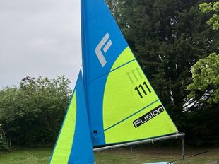 Fusion sailing dinghy with trolley and cover with option for road base