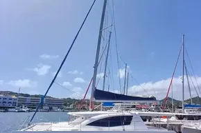 2017 Leopard 48 yacht docked in a sunny marina, clear blue sky background.
