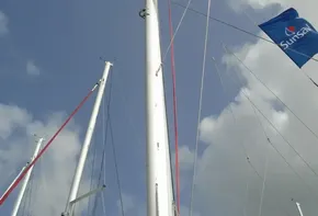 Leopard 45 sailboat mast and rigging against a cloudy sky, 2017 model.