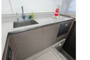 Modern kitchen area in 2021 Leopard 50 yacht with sink and countertop.