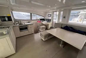 Interior of 2019 Leopard 51 Powercat yacht with modern kitchen and dining area.
