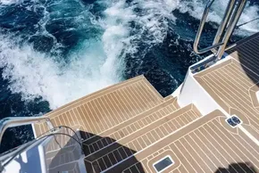 Sleek deck of 2025 Leopard 40 Powercat with ocean waves in the background.